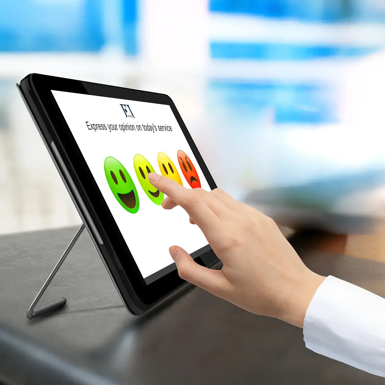 emoticon survey on a countertop tablet